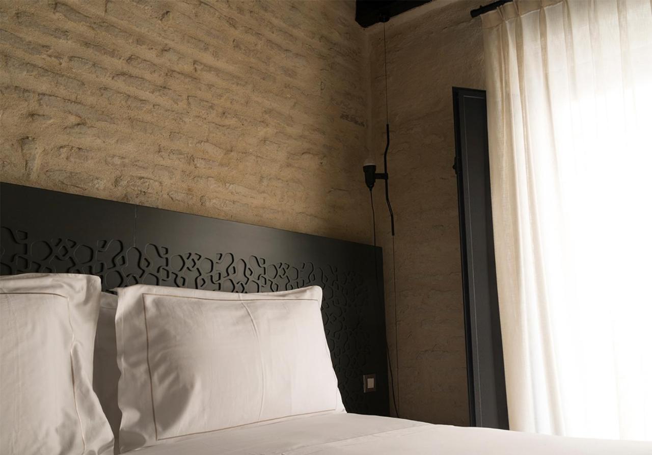 Eme Catedral Mercer Hotel Севиля Екстериор снимка A bedroom at the hotel